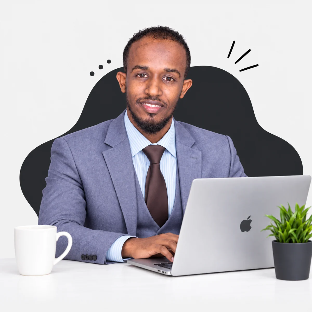 Cabdisamad Ibrahim smiling with his hands at the laptop
